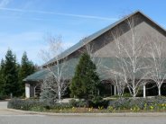 The landscaped front of a large theater. 