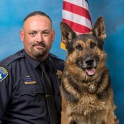 Photo of Sergeant Wilkey and retired K-9 Cash 